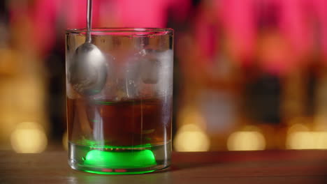 cocktail being prepared at a bar