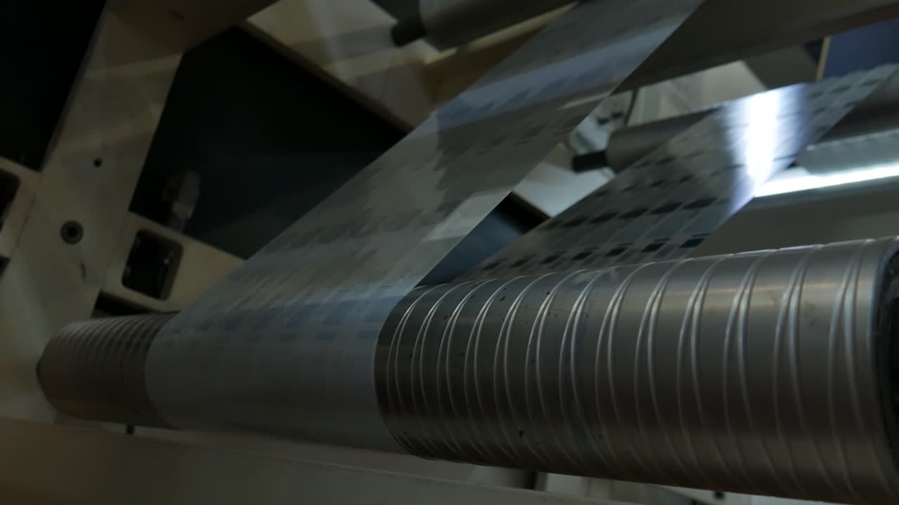 labels passing quickly in a chain production factory, an industrial revolution in a warehouse where labels for products are made