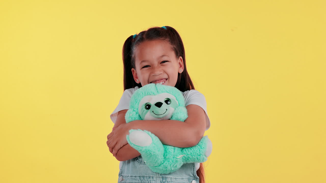 Girl hugging a stuffed animal