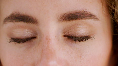 portrait of a woman with blue eyes staring