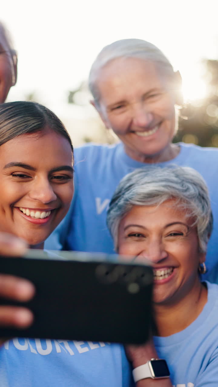 Happy Diverse Group of Volunteers Taking a Selfie Outdoors