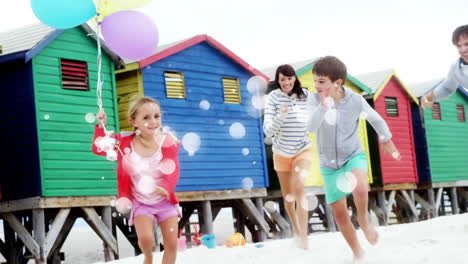 moving spots of white light with family on beach