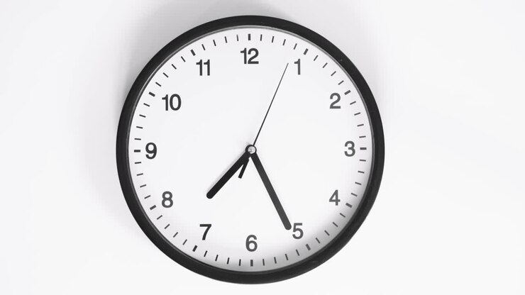 Close up video of clock face on wall