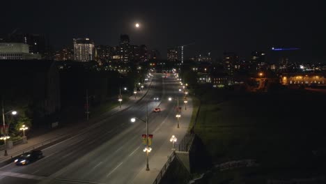 drone shot portage bridge over ottawa river at night in canadian capital city