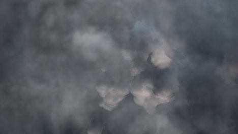 view of strong thunder storm in black clouds