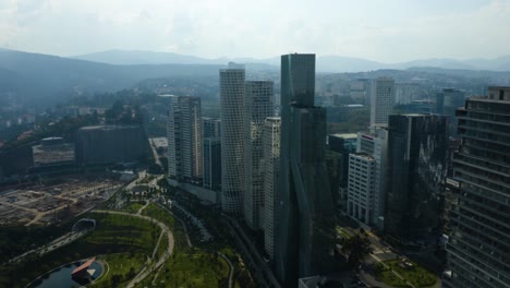 Modern-Skyscrapers-in-Mexico-City's-Santa-Fe-District,-Sierra-Madre-Mountains