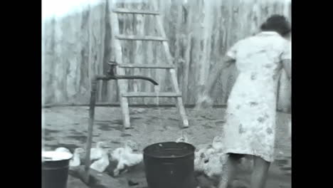 woman standing on top of wooden fence in soviet union archive. circa ussr 1970: a woman in the soviet union stands atop a wooden fence, embodying the spirit of communism and the resilience of the soviet people.