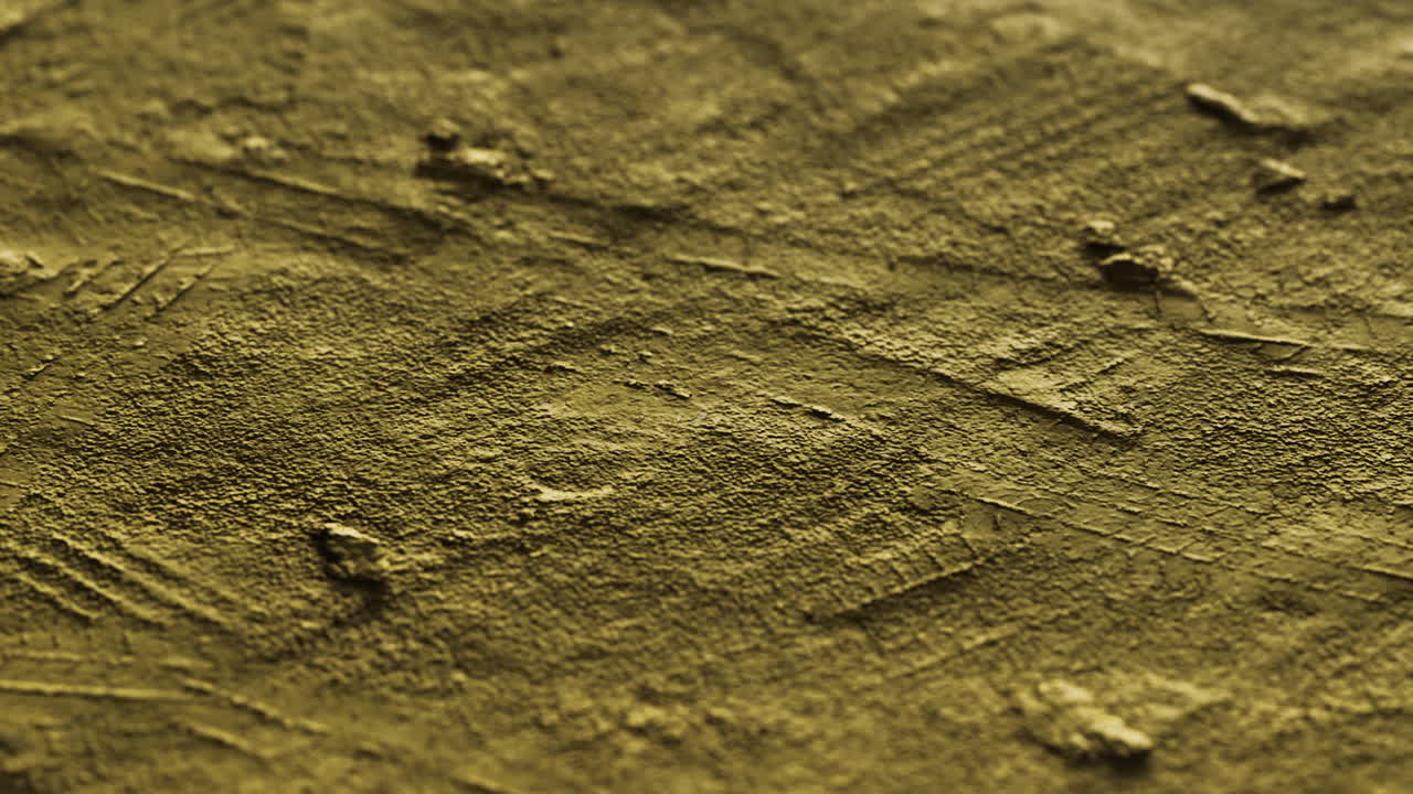 Textured surface in rich gold with intricate patterns and lines