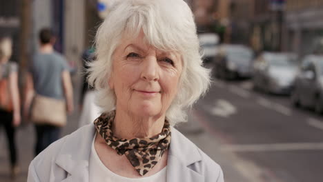 slow motion portrait of happy mature old woman smiling