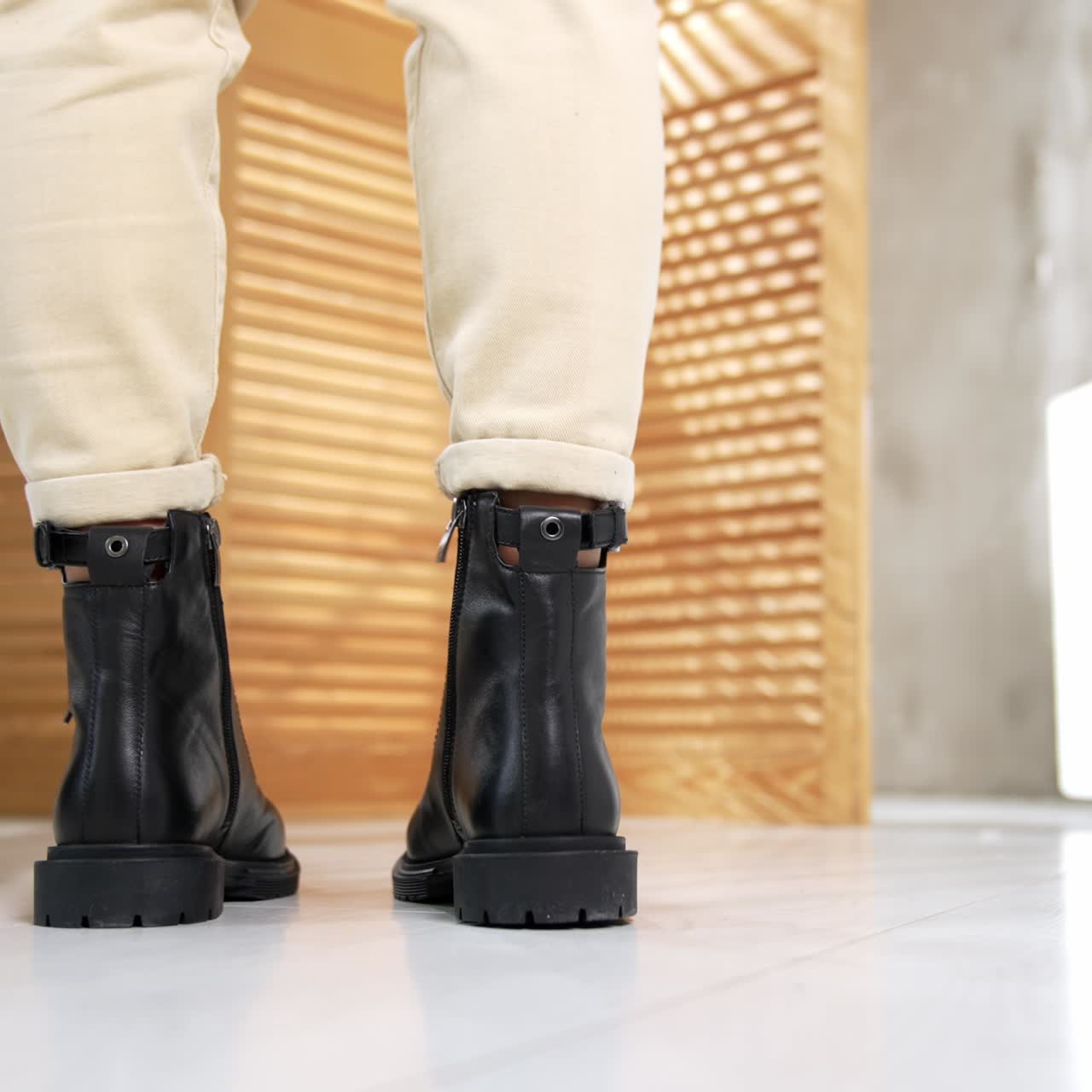 Woman stylish footwear showroom. Boutique lady shoes trying