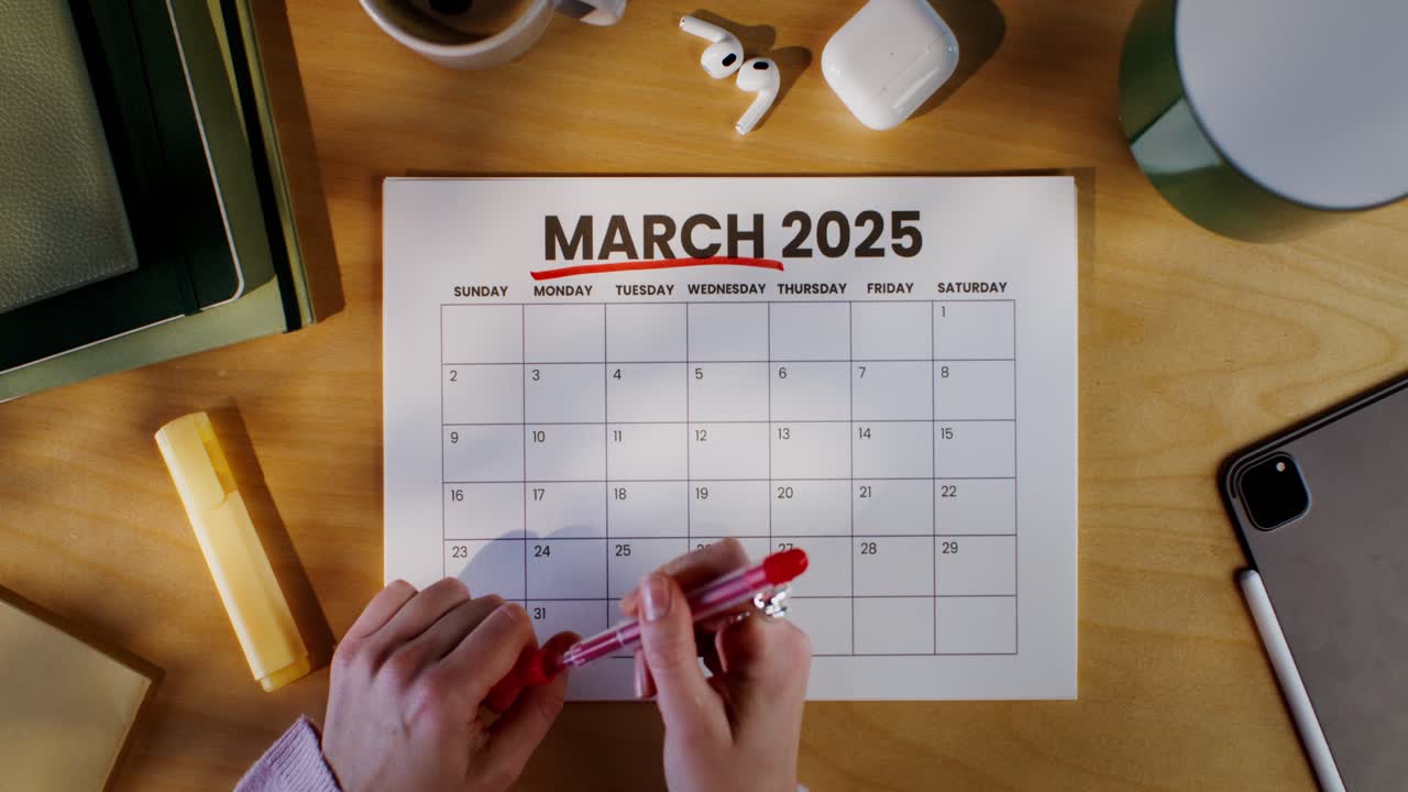 Woman Planning March 2025 Calendar