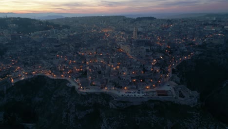 The-Italian-town-of-Matera-after-sunset,-illuminated-by-street-lamps