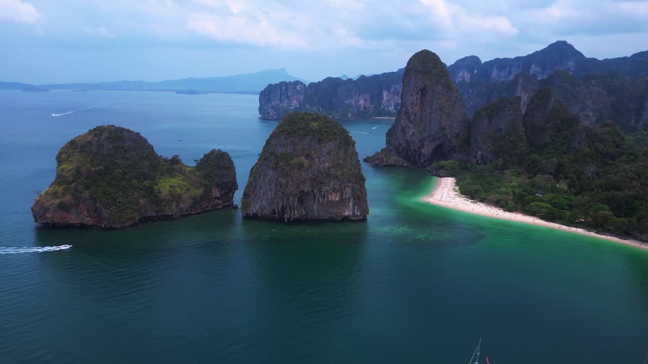 Rai Leh Beach and Ao Phra Nang Beach with turquoise waters and limestone cliffs in Krabi, Thailand. Fabulous aerial view flight panorama orbit drone