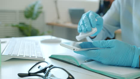 cleaning a smartphone in a workplace setting
