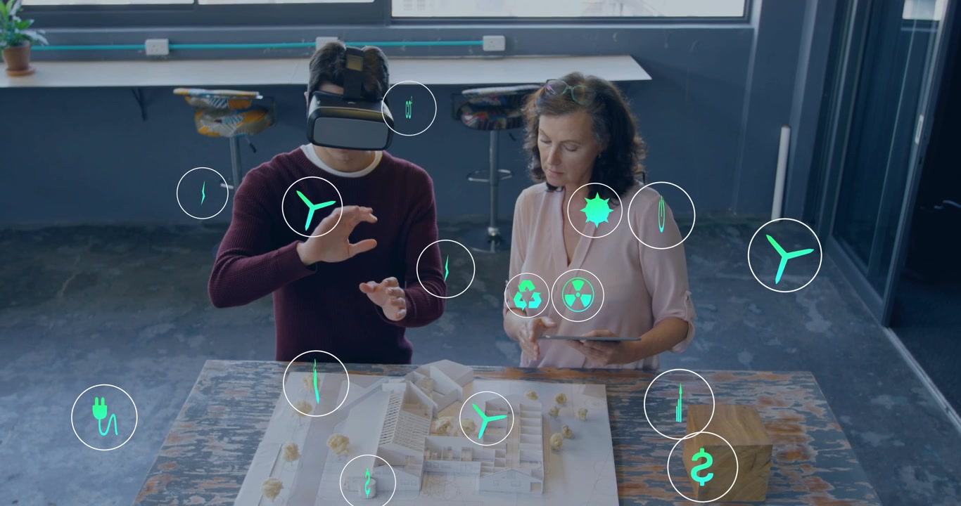 Man with VR gesturing over model woman on tablet causing floating energy icons for design review