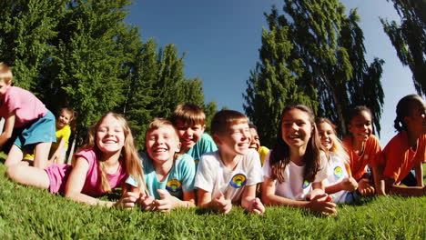 happy children playing together on grass outdoors