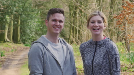 portrait of couple exercising in countryside during covid 19 lockdown