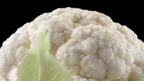 closeup shooting of rotating cauliflower on black background