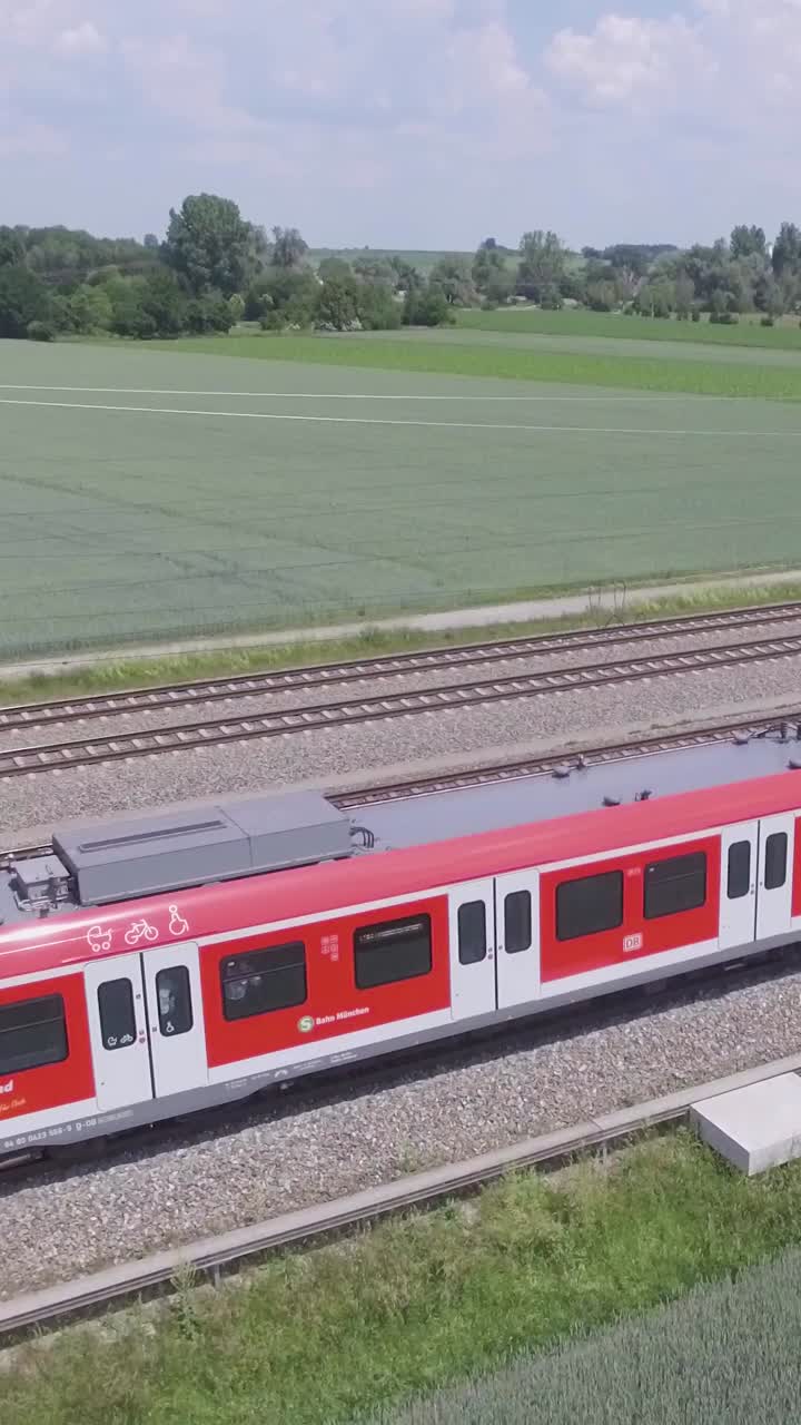 S-Bahn train moving on sunny day, scenic countryside view