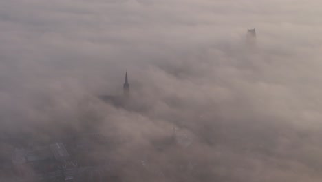 Time-lapse-of-rolling-clouds-at-Bolsward-during-sunrise,-aerial