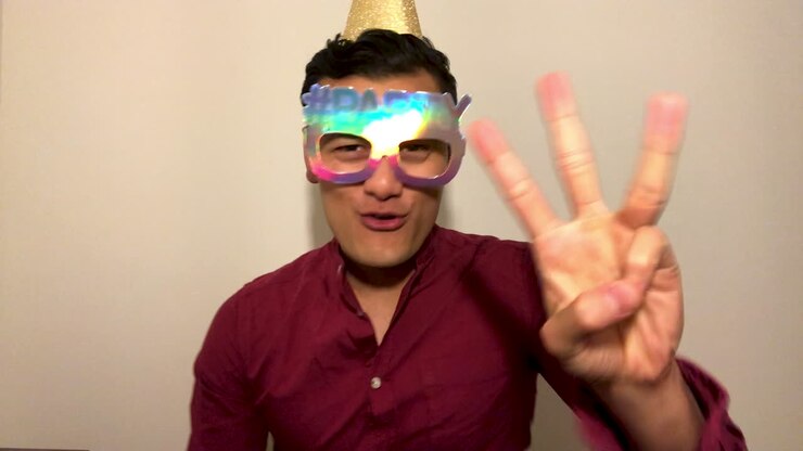 Young Man On Video Call Counting Down to Midnight and Celebrating Turn of New Year