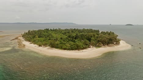 an aerial drone shot of alingkakajaw island - claver, surigao del norte, philippines