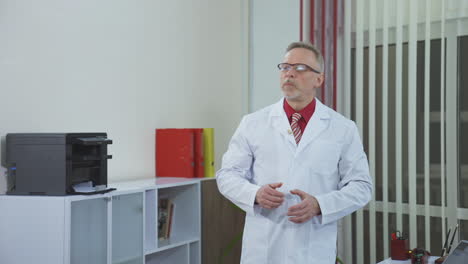 physician talking using video call. portrait of mature male therapist share information provide support