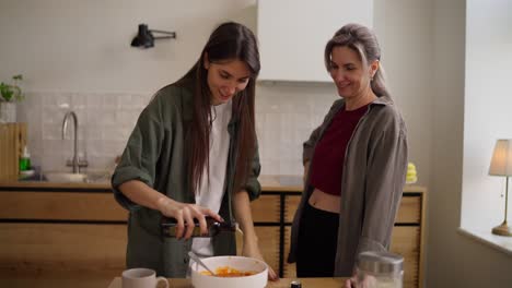 mother and daughter cooking together