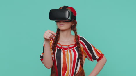 redhead girl in headset helmet app to play simulation realistic game, watching virtual reality video