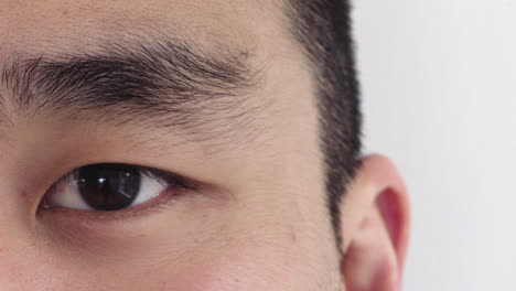 close-up-asian-man-eye-opening-looking-at-camera-healthy-eyesight-concept