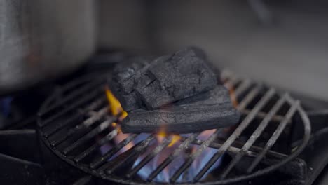 charcoal heating up on a gas grill