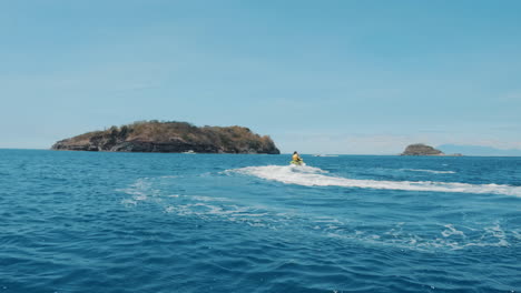 cinematic slomo shot of a jetski running through the clear blue waters of the philippines, asia, slow motion, waverunner