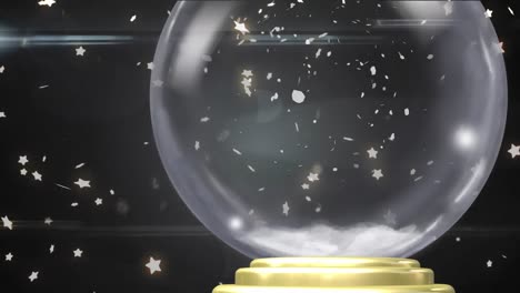 animation of christmas snow globe with snow falling on black background