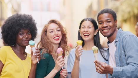 happy diverse friends enjoying ice cream together