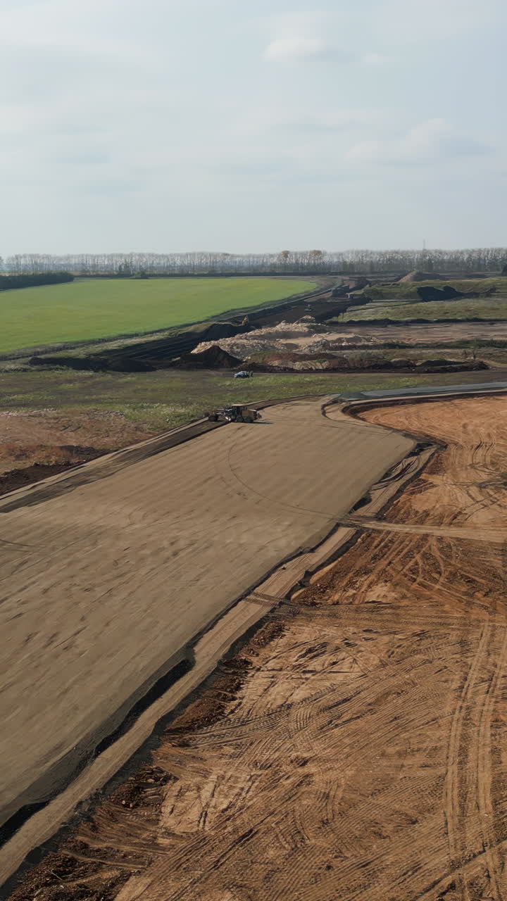 Aerial View of Construction Site with Earthwork and Machinery