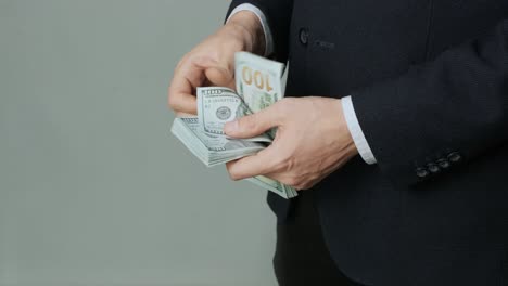 men's hands quickly count banknotes. businessman counts dollars in hands. usd