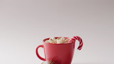 video of cup of hot chocolate with marshmallows over white background