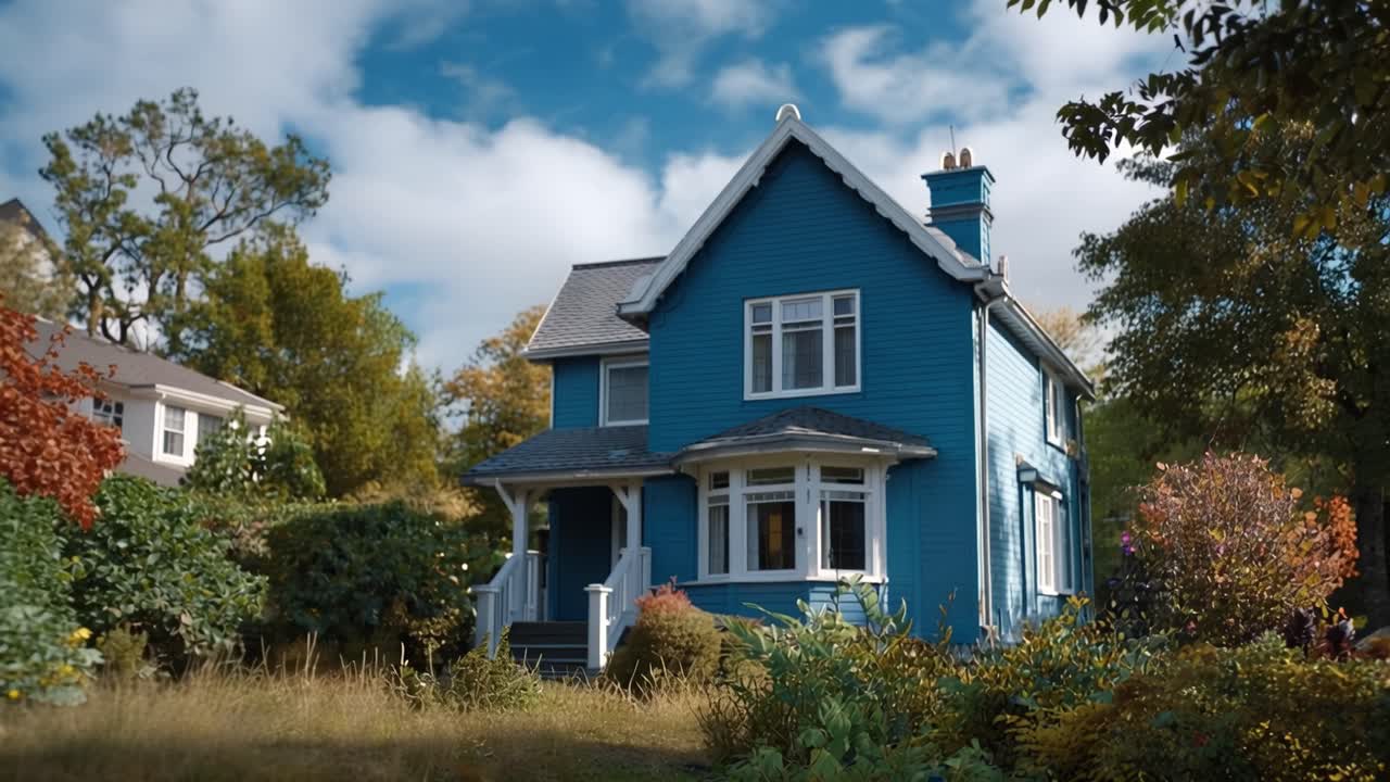 Charming Blue House with 'For Sale' Sign in the Front Yard Surrounded by Lush Greenery and Trees, Perfect for Family Living in a Beautiful Neighborhood