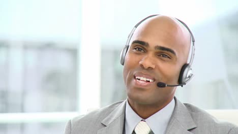 charming businessman with headset on