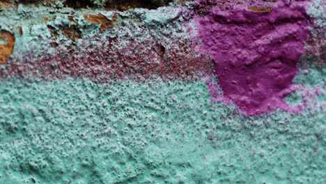 dolly in shot of an old, painted wall