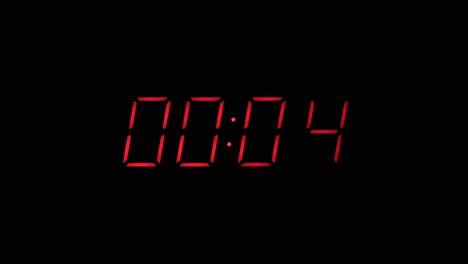 red digital clock countdown to zero slow zoom in