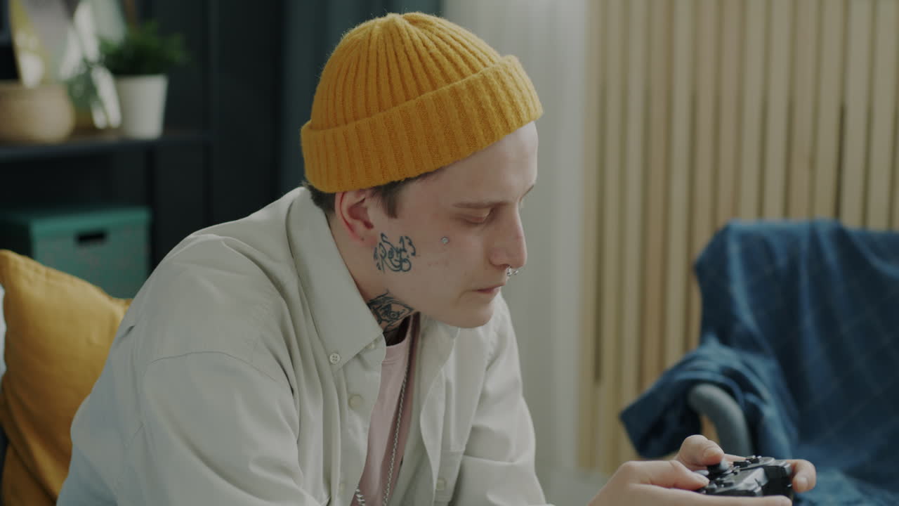 Young man gaming at home