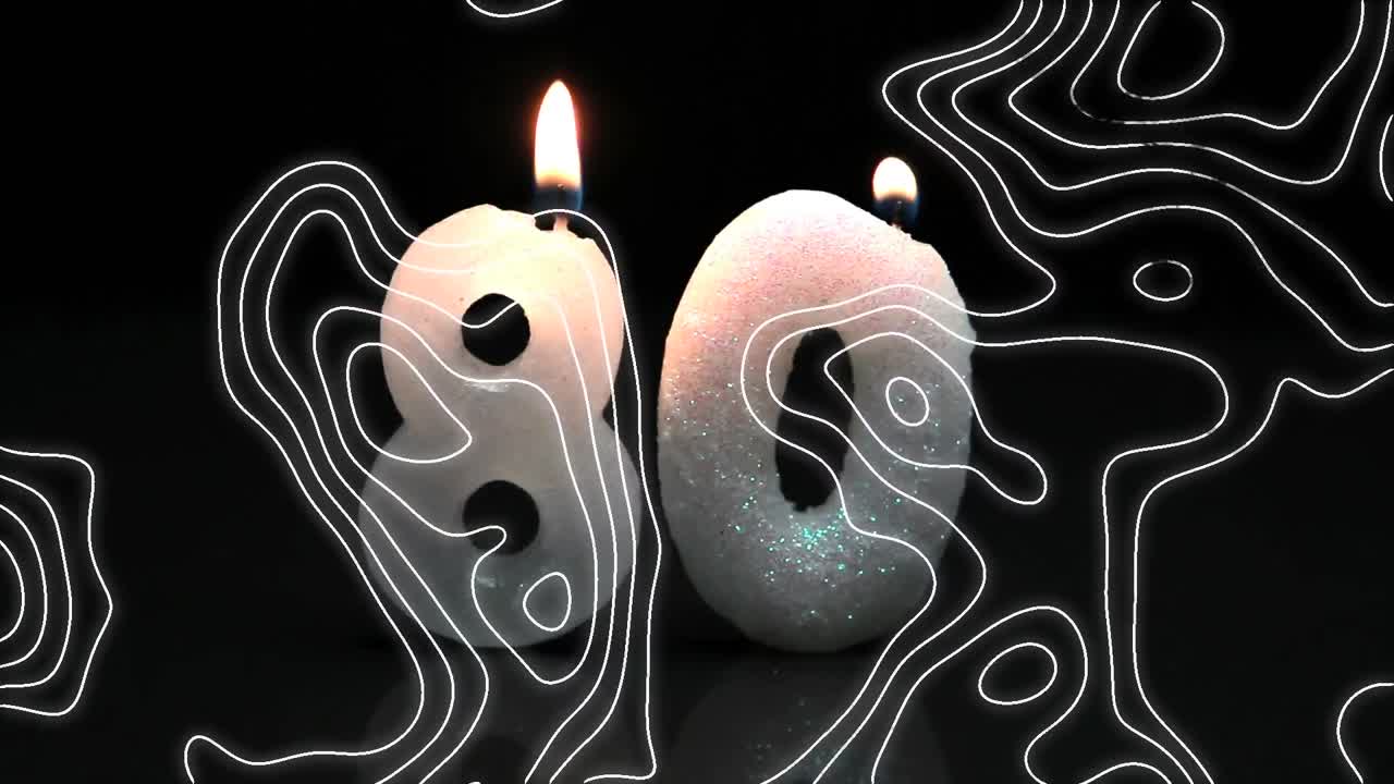 ⁇ 색 윤 ⁇  선의 애니메이션이 숫자 80에 달린 생일  ⁇ 불을 움직이고 있습니다.