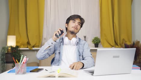 A-male-student-spraying-perfume.