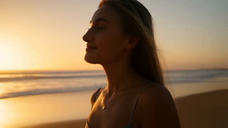 young woman enjoying a serene sunset on the beach