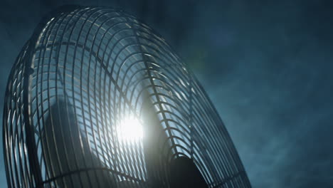 fan blades rotate in rays of light and fog. slider shot