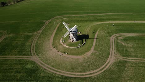 chesterton windmill listed building aerial birdseye orbit left view over picturesque english rural countryside agricultural field