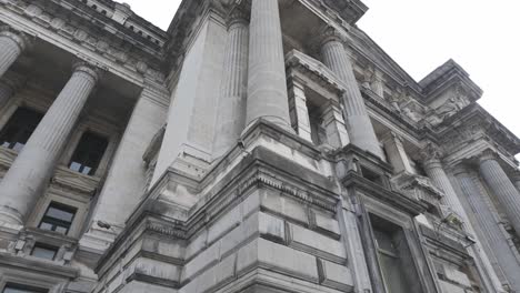 low angle view highlighting the columns of the palace of justice in brussels.