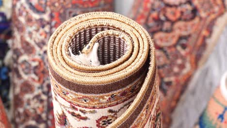 rolled traditional patterned rug