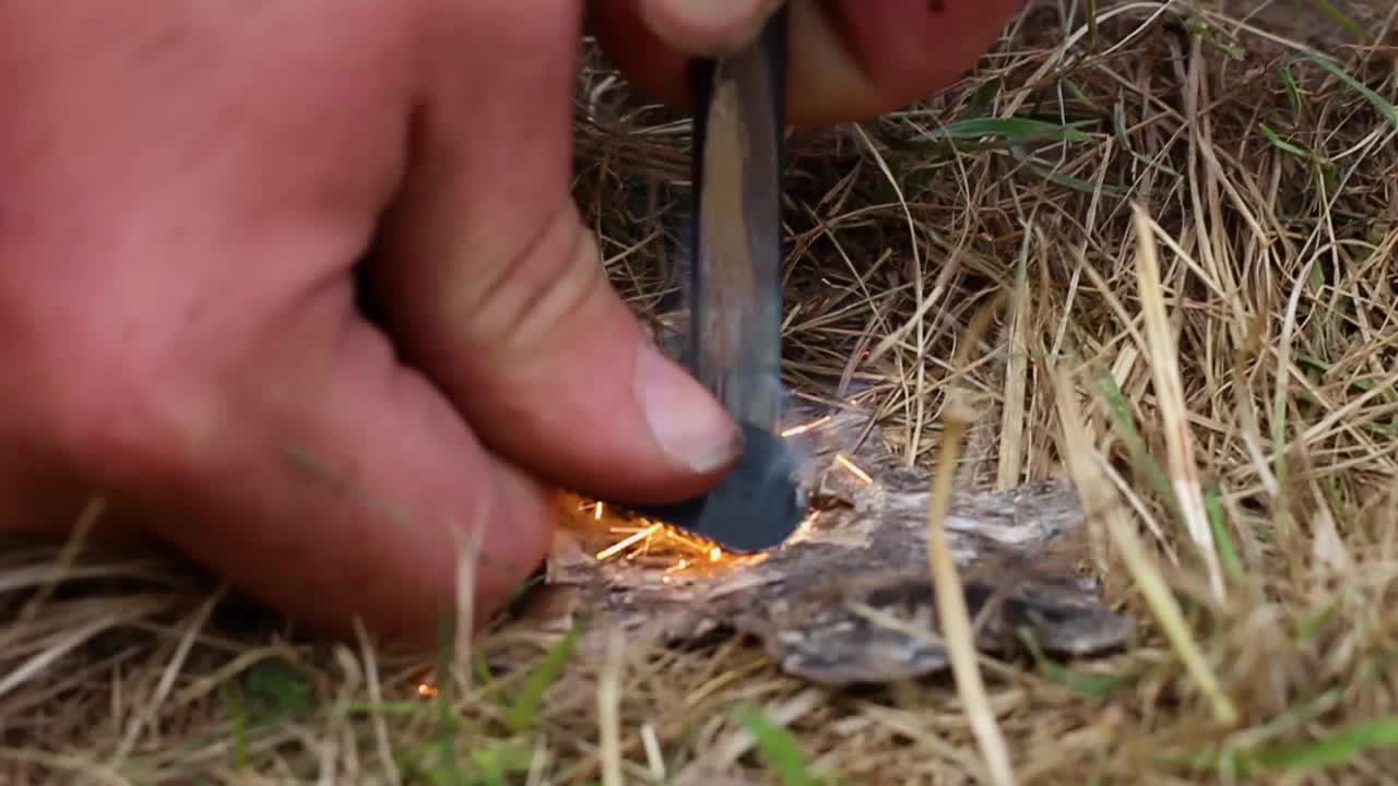 Setting a fire with flint and steel